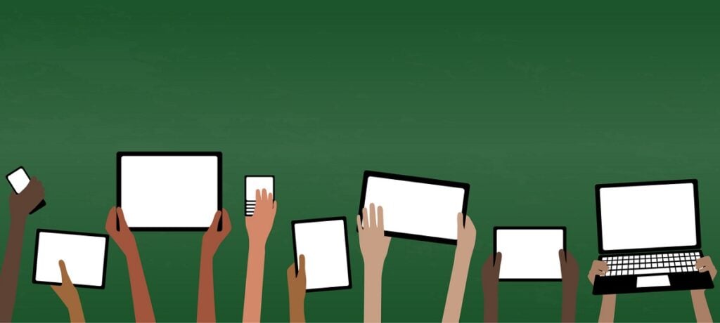 Image showing multiple people with their personal devices such as laptops, tablets, and smartphones