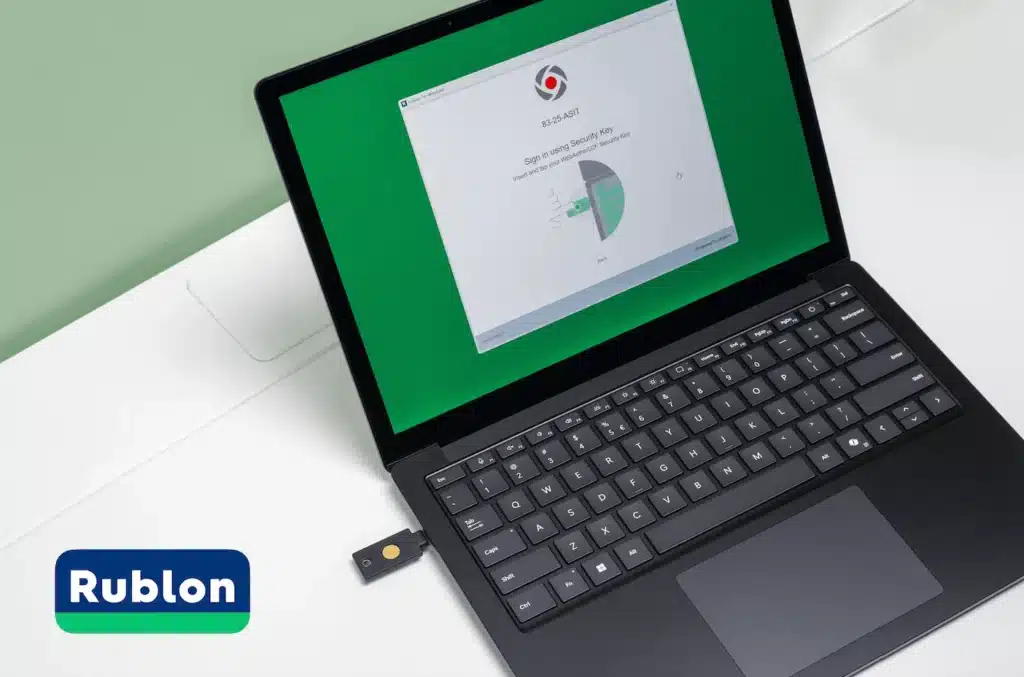 A laptop protected by the Rublon MFA platform requires FIDO key authentication as the second factor.